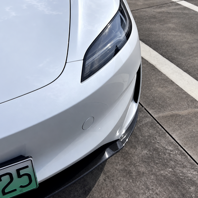 Gloss carbon fiber front lip installed on Tesla Model 3 Highland Performance - view 2