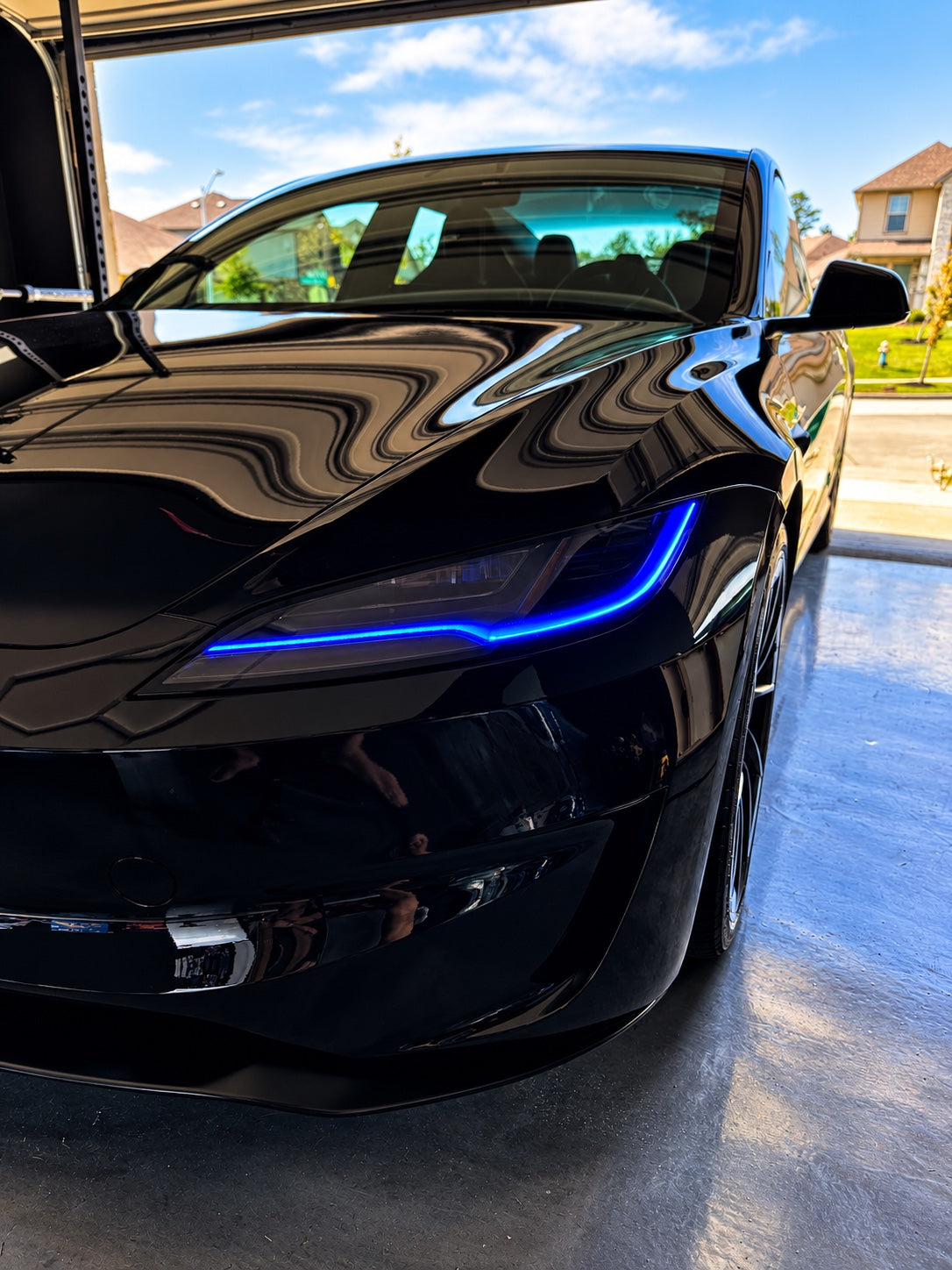 Blue DRLs on Jonathan’s black Tesla Model 3 Highland